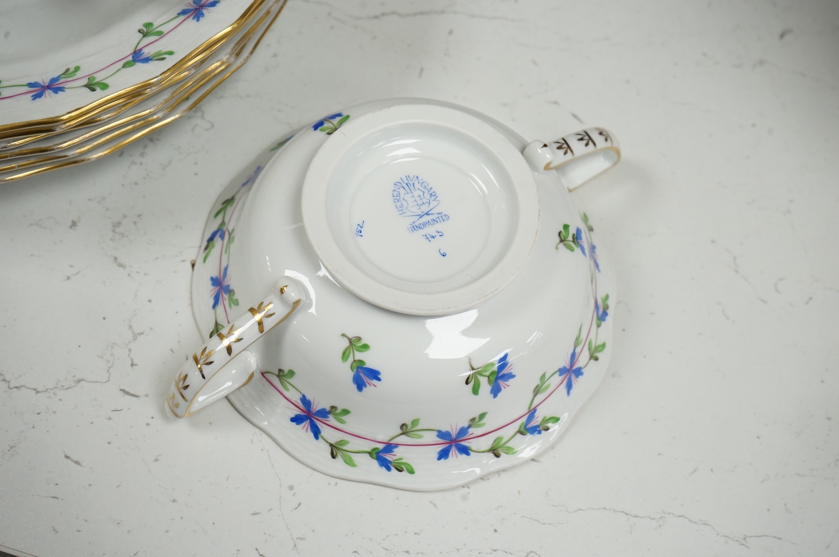 A Herend blue garland part tea set to include plates, twin handles cups and crescent dishes, largest 23cm in diameter